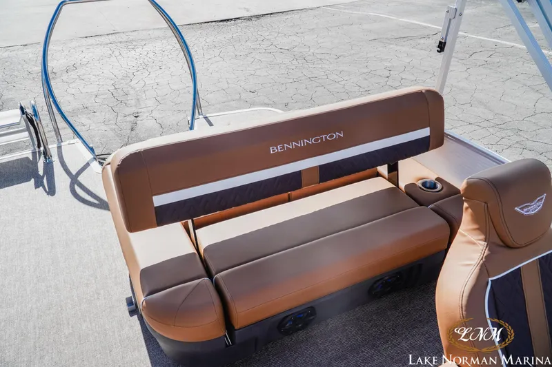 Slide: The Image of 2025 Bennington 22MSB boat interior with brown seating at Lake Norman Marina. - 12