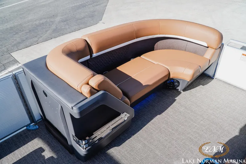 Slide: The Image of 2025 Bennington 22MSB boat interior with luxurious tan seating and modern design. - 14