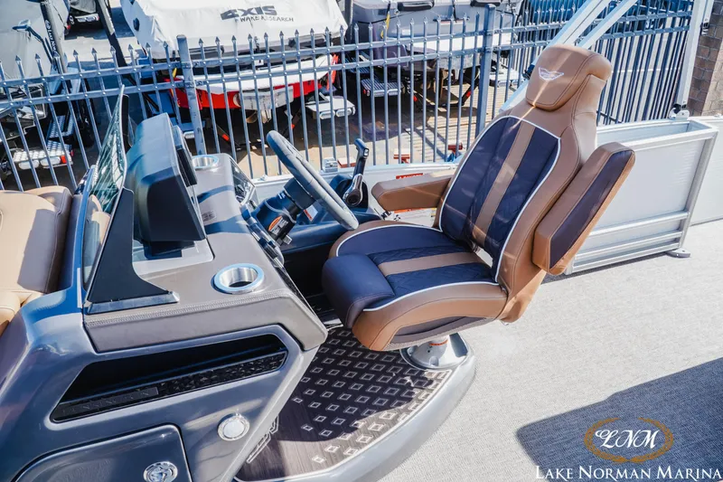 Slide: The Image of Captain's chair and helm of 2025 Bennington 22MSB at Lake Norman Marina. - 15