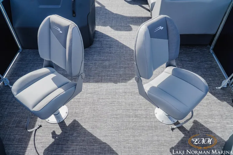 Slide: The Image of Two gray seats on a 2024 Bennington 22SF-SPS boat at Lake Norman Marina. - 11