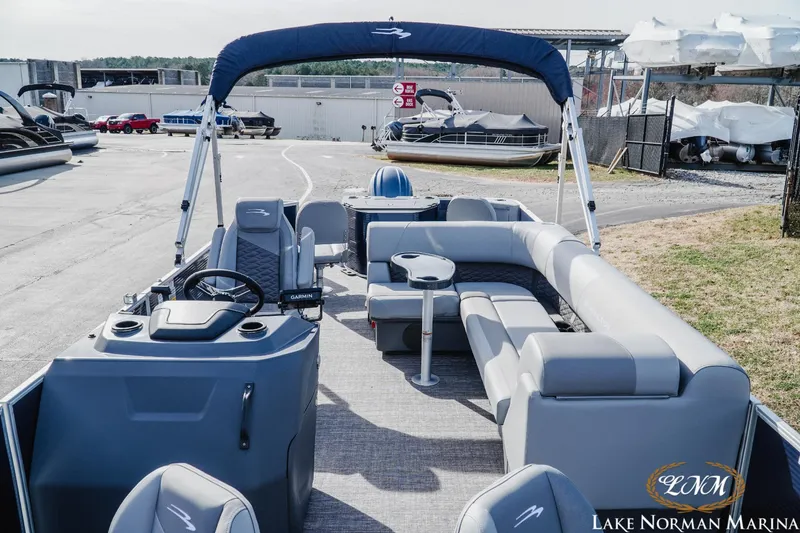 Slide: The Image of 2024 Bennington 22SF-SPS pontoon boat with spacious seating at Lake Norman Marina. - 12