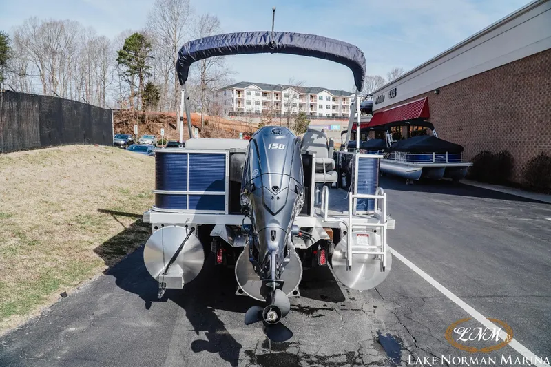 Slide: The Image of 2024 Bennington 22SF-SPS pontoon boat with outboard motor at Lake Norman Marina. - 4