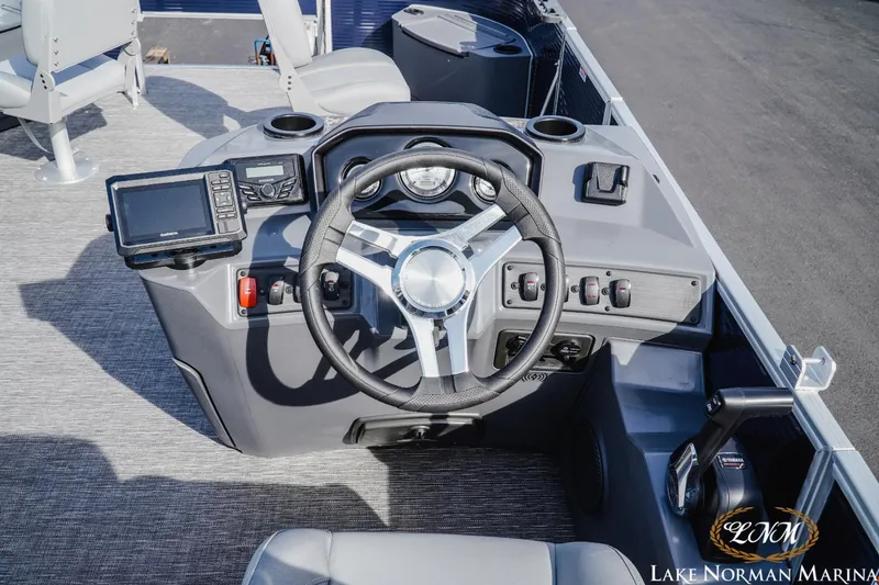 Slide: The Image of 2024 Bennington 22SF-SPS boat dashboard with steering wheel and navigation controls. - 8
