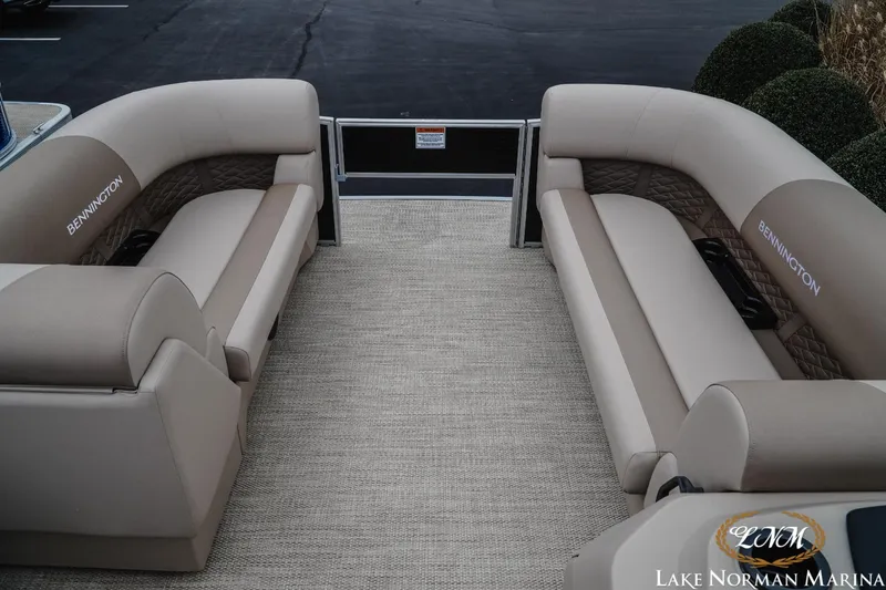 Slide: The Image of 2024 Bennington 22ss-sps pontoon boat interior with beige seating at Lake Norman Marina. - 11