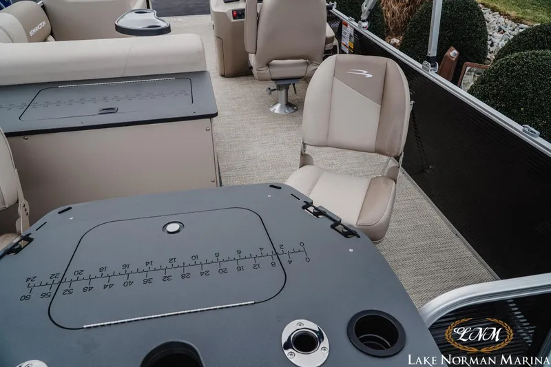 Slide: The Image of 2024 Bennington 22ss-sps pontoon boat interior with seating and measurement table. - 6