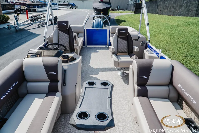 Slide: The Image of 2025 Bennington 22SSR pontoon boat interior with luxurious seating at Lake Norman Marina. - 13