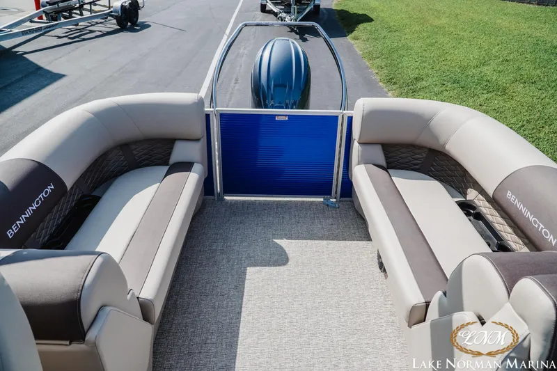 Slide: The Image of 2025 Bennington 22SSR pontoon boat interior with plush seating at Lake Norman Marina. - 15