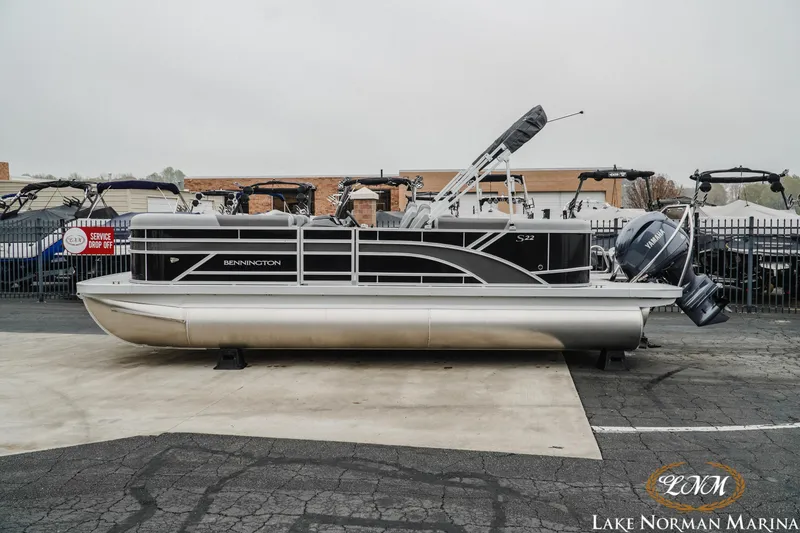 Slide: The Image of 2025 Bennington 22SSR pontoon boat displayed at Lake Norman Marina. - 1