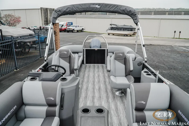 Slide: The Image of 2025 Bennington 22SSR pontoon boat interior with gray seating at Lake Norman Marina. - 12