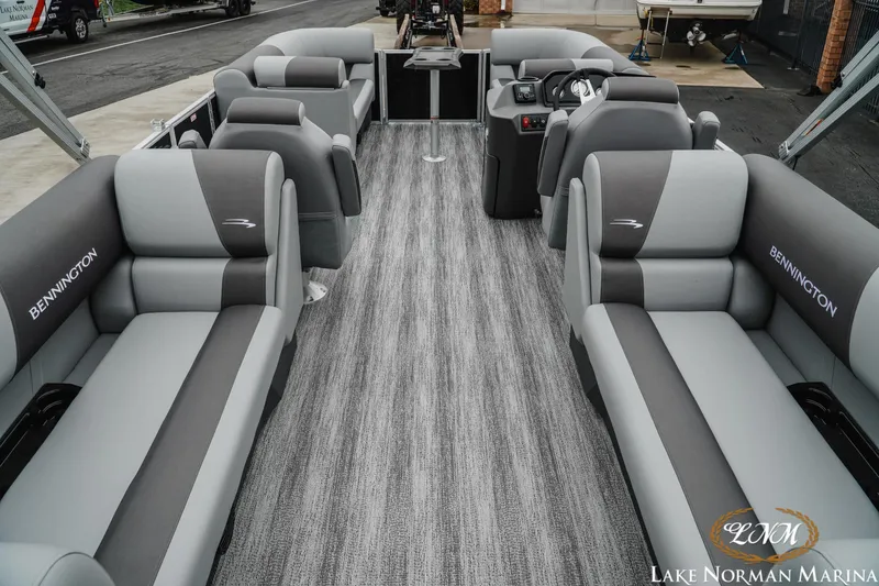Slide: The Image of 2025 Bennington 22SSR pontoon boat interior with gray seating at Lake Norman Marina. - 5