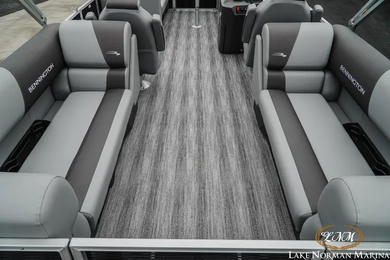 Slide: The Image of 2025 Bennington 22SSR pontoon boat interior with gray seating and carpet flooring. - 6