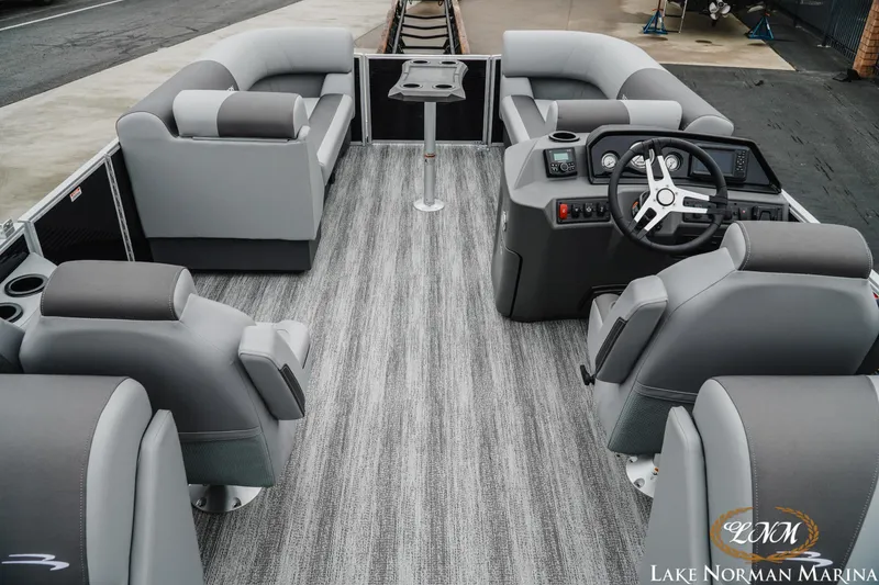 Slide: The Image of 2025 Bennington 22SSR pontoon boat interior with gray seating and modern helm. - 7