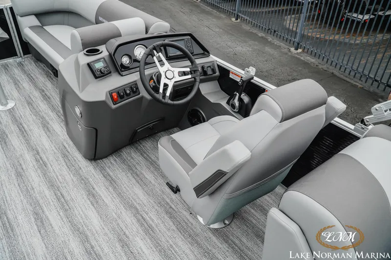 Slide: The Image of 2025 Bennington 22SSR boat interior with modern steering console and seating. - 8