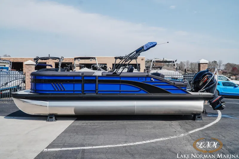 Slide: The Image of 2025 Bennington 23LSB pontoon boat in blue at Lake Norman Marina. - 1