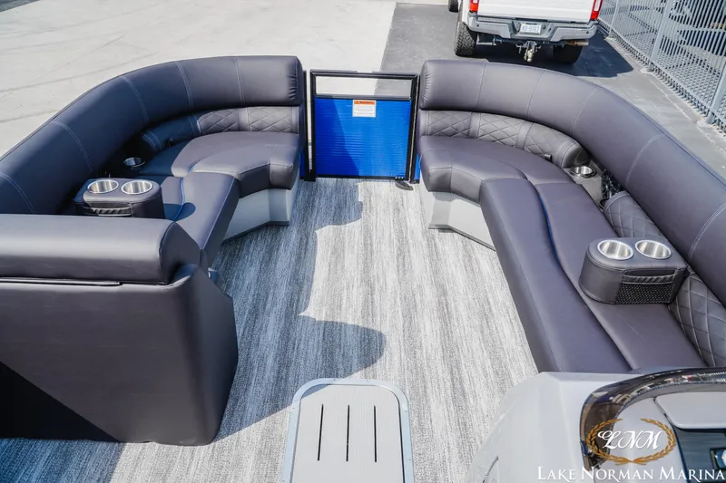 Slide: The Image of 2025 Bennington 23LSB pontoon boat interior with luxurious seating and cup holders. - 11