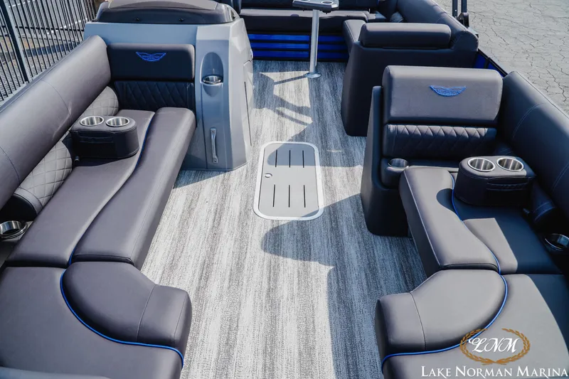 Slide: The Image of 2025 Bennington 23LSB pontoon boat interior with luxurious seating and cup holders. - 13