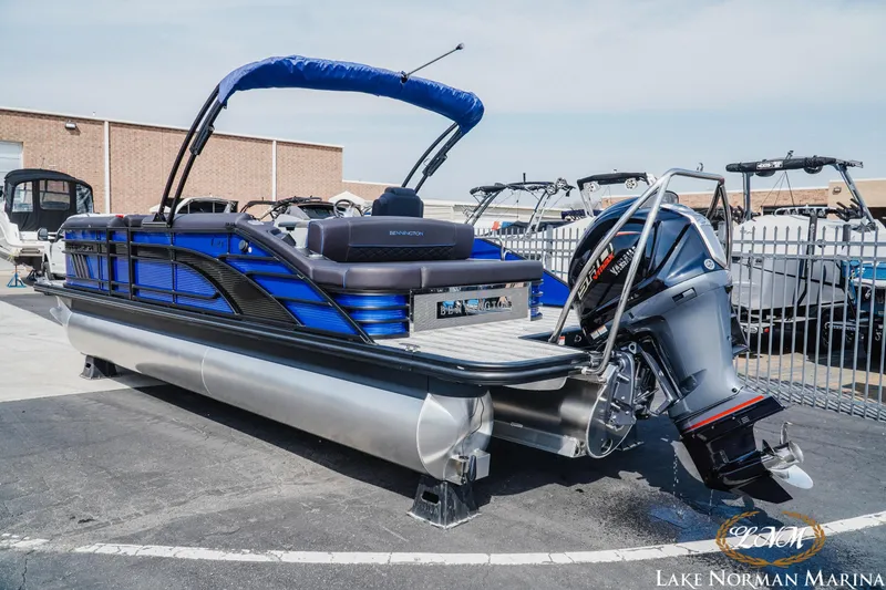 Slide: The Image of 2025 Bennington 23LSB pontoon boat with Yamaha outboard at Lake Norman Marina. - 2