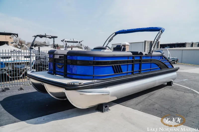 Slide: The Image of 2025 Bennington 23LSB pontoon boat in blue at Lake Norman Marina. - 3