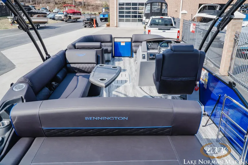 Slide: The Image of 2025 Bennington 23LSB pontoon boat interior with luxurious seating and modern helm at Lake Norman Marina. - 6