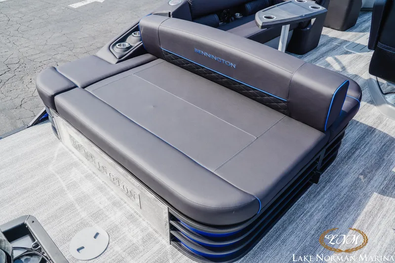 Slide: The Image of 2025 Bennington 23LSB boat seating with sleek design and cup holders at Lake Norman Marina. - 7