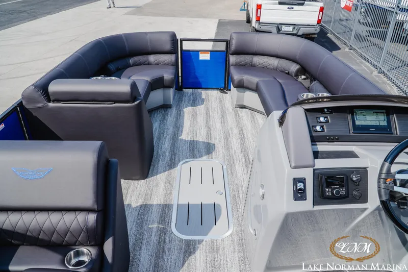 Slide: The Image of 2025 Bennington 23LSB pontoon boat interior with luxurious seating and modern dashboard. - 8