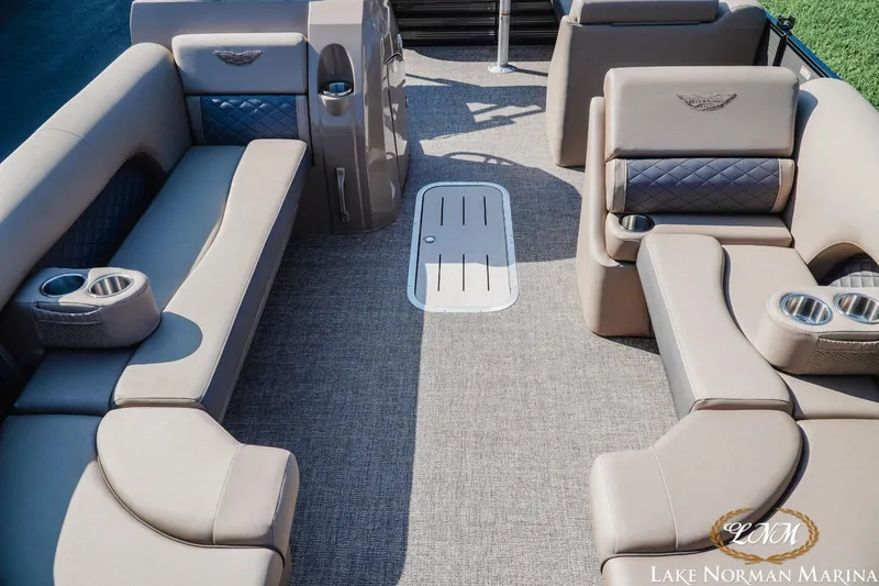 Slide: The Image of 2025 Bennington 23LSB pontoon boat interior with luxurious seating and cup holders. - 13