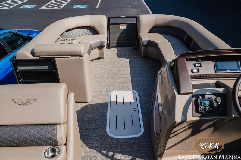 Slide: The Image of 2025 Bennington 23LSB pontoon boat interior with luxurious seating and modern dashboard. - 8