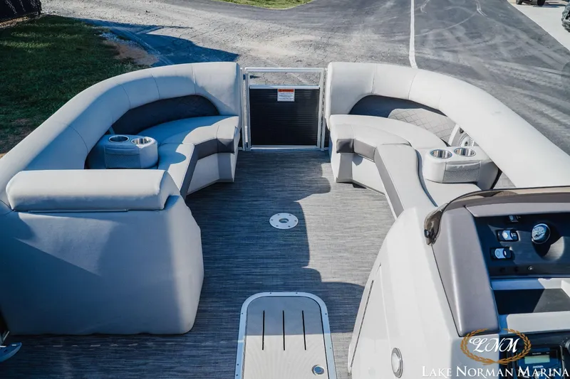 Slide: The Image of 2023 Bennington 23LSR pontoon boat interior with plush seating and cup holders. - 12