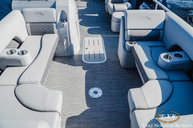 Slide: The Image of 2023 Bennington 23LSR pontoon boat interior with luxurious seating and cup holders. - 13