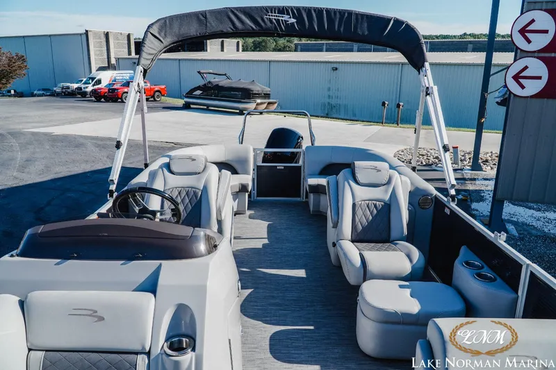 Slide: The Image of 2023 Bennington 23LSR pontoon boat with luxurious seating at Lake Norman Marina. - 14