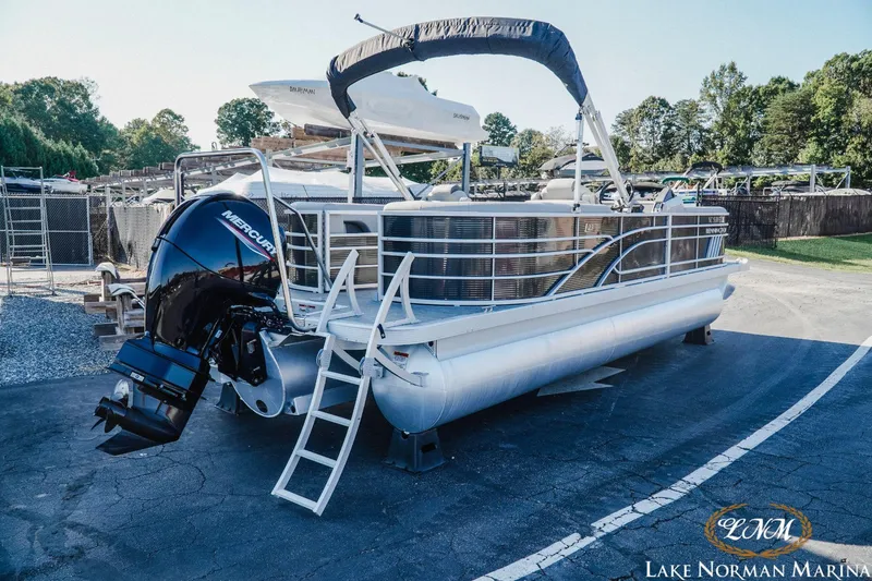 Slide: The Image of 2023 Bennington 23LSR pontoon boat with Mercury engine at Lake Norman Marina. - 2