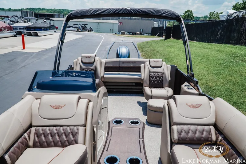 Slide: The Image of 2024 Bennington 23LXSSB pontoon boat interior with luxurious seating at Lake Norman Marina. - 11