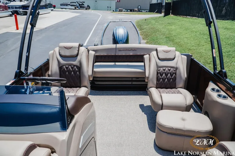 Slide: The Image of 2024 Bennington 23LXSSB pontoon boat interior with luxurious seating at Lake Norman Marina. - 13
