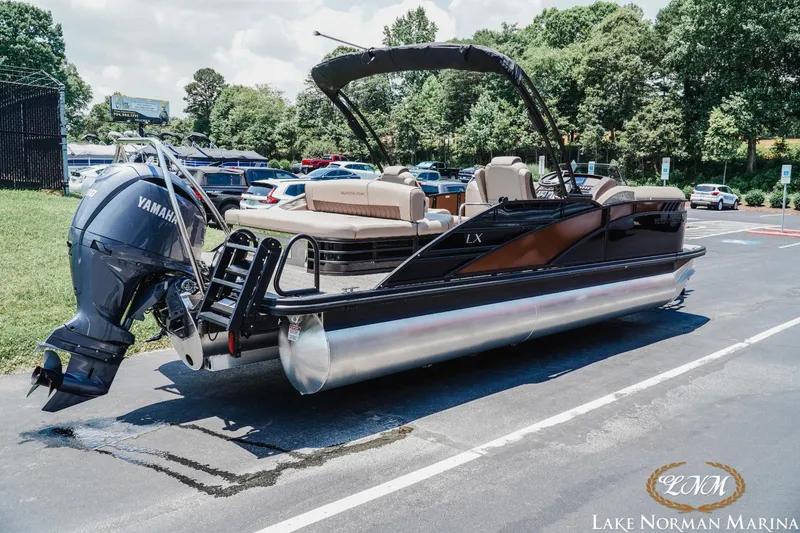 Slide: The Image of 2024 Bennington 23LXSSB pontoon boat with Yamaha engine at Lake Norman Marina. - 3
