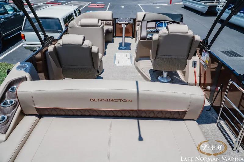 Slide: The Image of 2024 Bennington 23LXSSB pontoon boat interior with luxurious seating and modern design. - 5