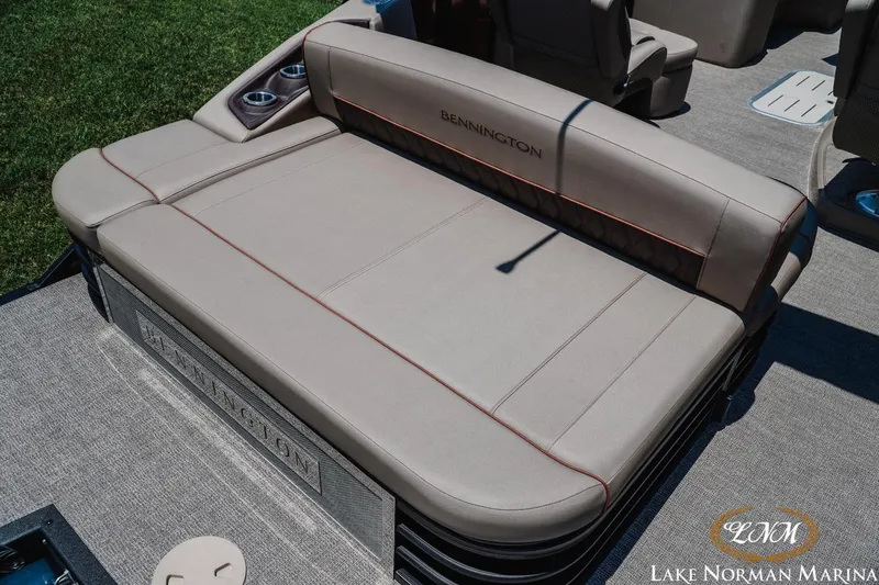 Slide: The Image of 2024 Bennington 23LXSSB boat with luxurious seating at Lake Norman Marina. - 6