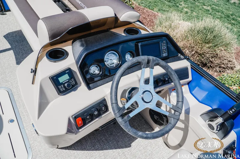 Slide: The Image of 2025 Bennington 23ssb boat dashboard with steering wheel and control panel. - 10