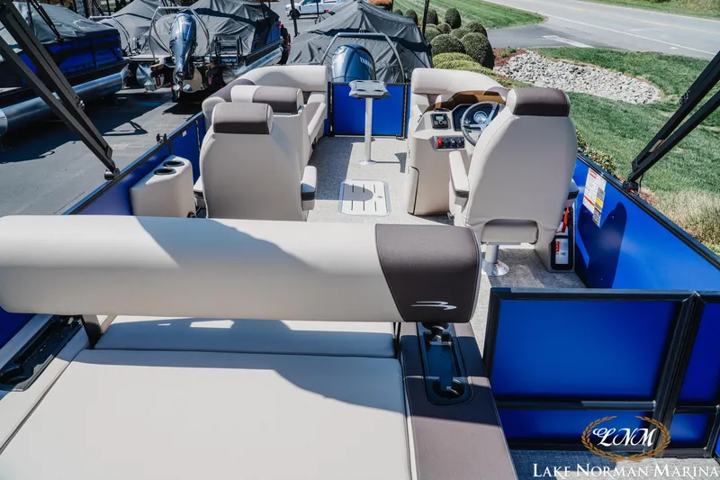 Slide: The Image of 2025 Bennington 23ssb pontoon boat interior with seating and helm, at Lake Norman Marina. - 5