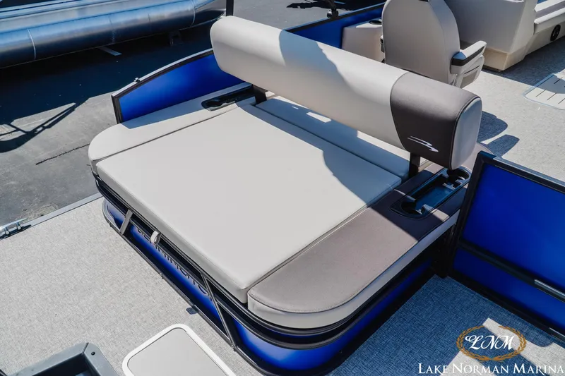 Slide: The Image of 2025 Bennington 23SSB pontoon boat interior with cushioned seating at Lake Norman Marina. - 6