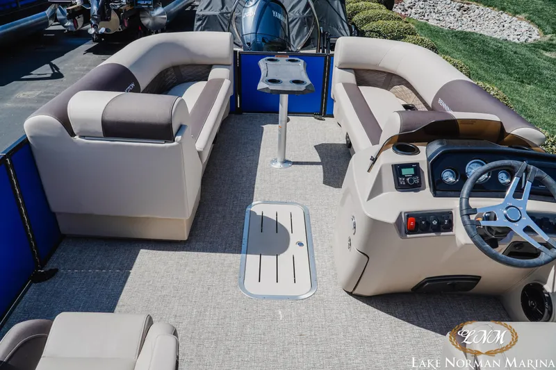 Slide: The Image of 2025 Bennington 23ssb pontoon boat interior with seating and helm at Lake Norman Marina. - 7