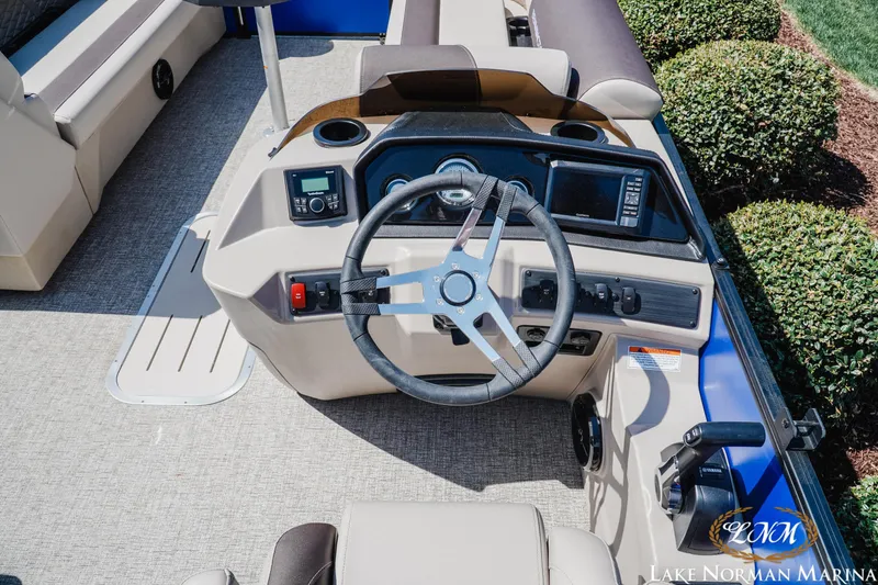 Slide: The Image of 2025 Bennington 23ssb boat dashboard with steering wheel and control panel. - 9