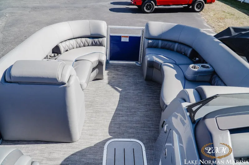Slide: The Image of 2023 Bennington 24LXSB pontoon boat interior with plush seating and cup holders. - 11