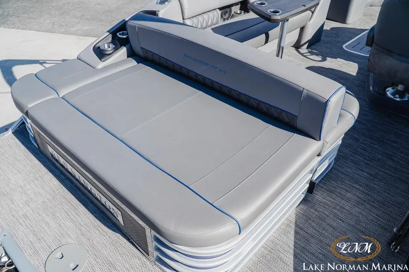 Slide: The Image of 2023 Bennington 24LXSB boat seating with gray upholstery and cup holders at Lake Norman Marina. - 5