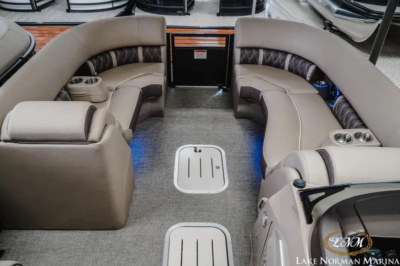 Slide: The Image of 2025 Bennington 24LXSSB pontoon boat interior with luxurious seating and cup holders. - 14