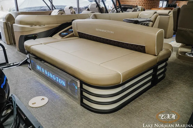 Slide: The Image of 2025 Bennington 24LXSSB pontoon boat interior with luxurious seating at Lake Norman Marina. - 8
