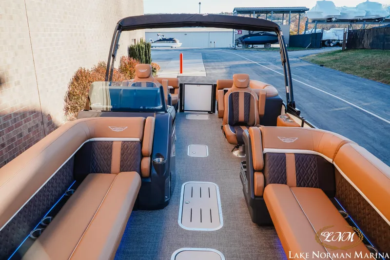Slide: The Image of Luxurious 2025 Bennington 24MFB pontoon boat with elegant seating at Lake Norman Marina. - 10