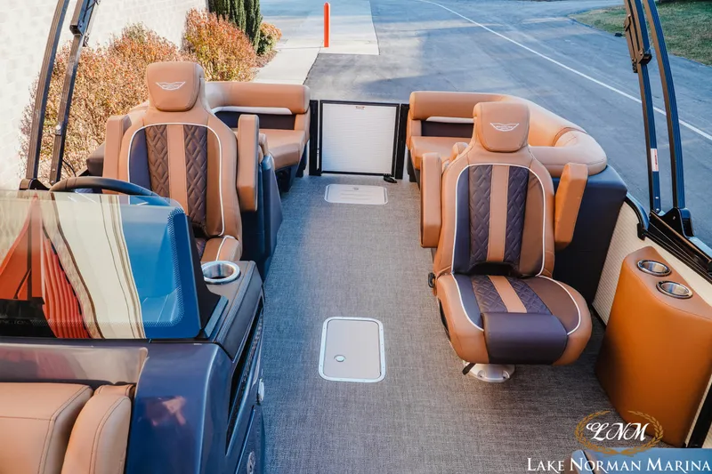 Slide: The Image of Luxurious interior of 2025 Bennington 24MFB pontoon boat with plush seating at Lake Norman Marina. - 12