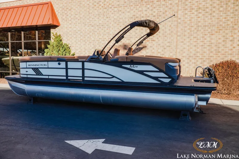 Slide: The Image of 2025 Bennington 24MFB pontoon boat displayed at Lake Norman Marina. - 2
