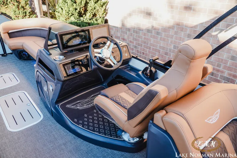 Slide: The Image of 2025 Bennington 24MFB boat interior with luxurious seating and advanced dashboard controls. - 7