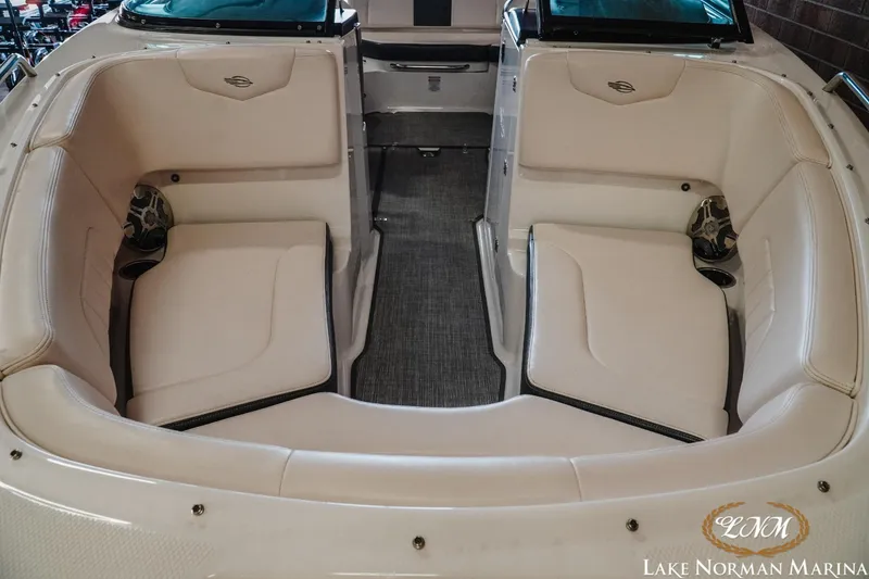 Slide: The Image of 2018 Chaparral 227 SSX boat interior with white seating and carpeted floor. - 12